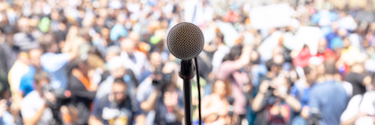 A microphone in front of a crowd