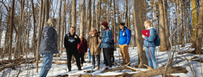 students learning in the snow at the arboretum