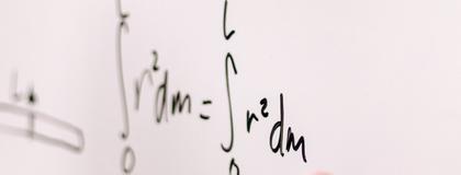 Math on a whiteboard.
