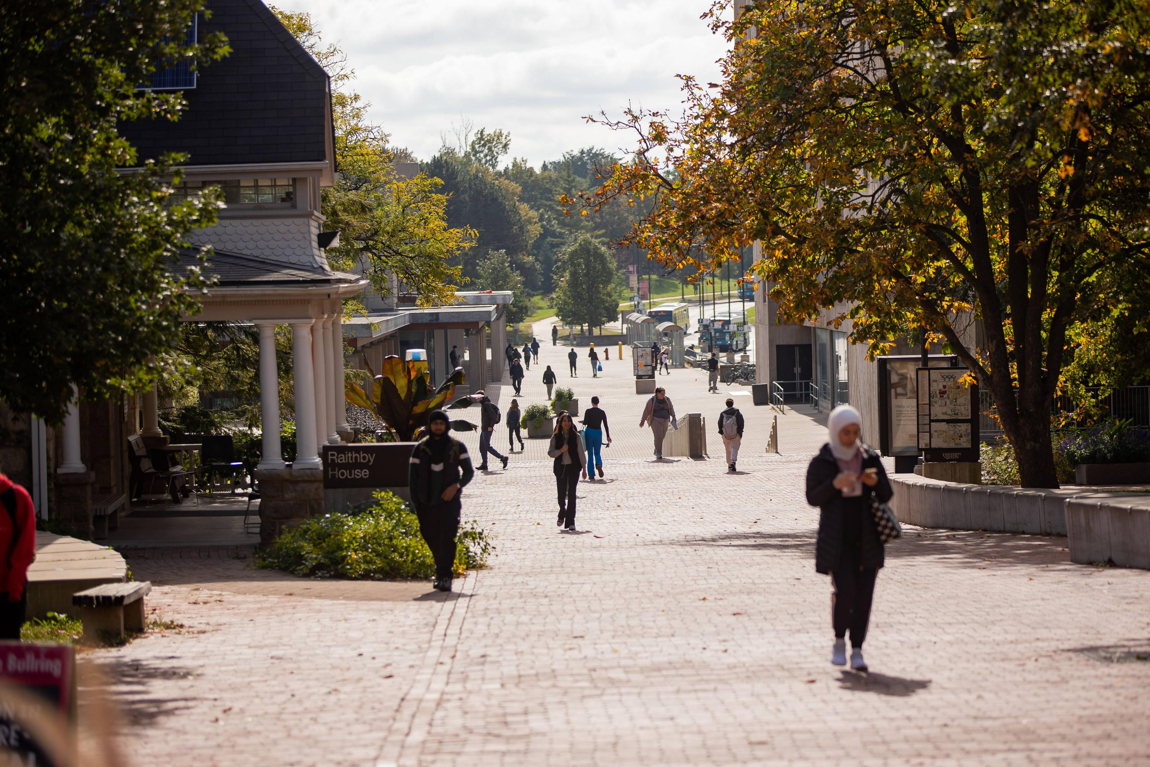Students walking on campus in the summer