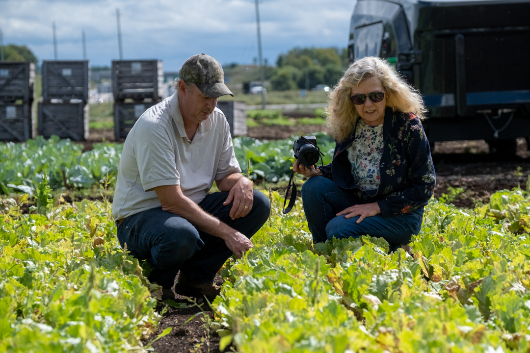 Dr. Mary Ruth McDonald in the field at the Ontario Crops Research Centre, Bradford with research technician Kevin.