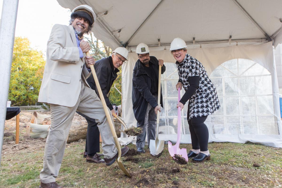 Picture of Ajay Heble, Franco Vaccarino, Dieter Janssen, and Samantha Brennan with shovels