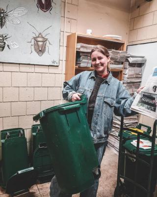 two Day Hall staff pose with an office compost bin