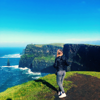 Student standing at the Cliffs of Moher, Ireland