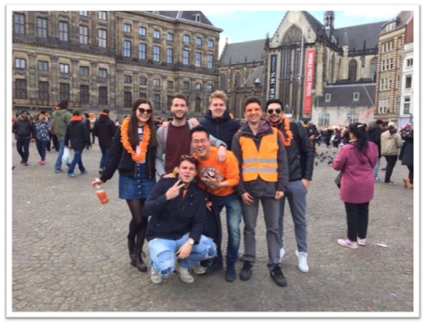 Photo of friends dressed up in orange