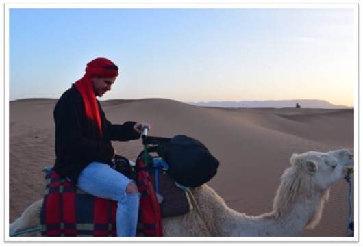 Photo of a student on a camel