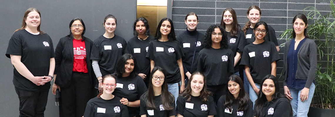 Group of smiling young women in black t-shirts 