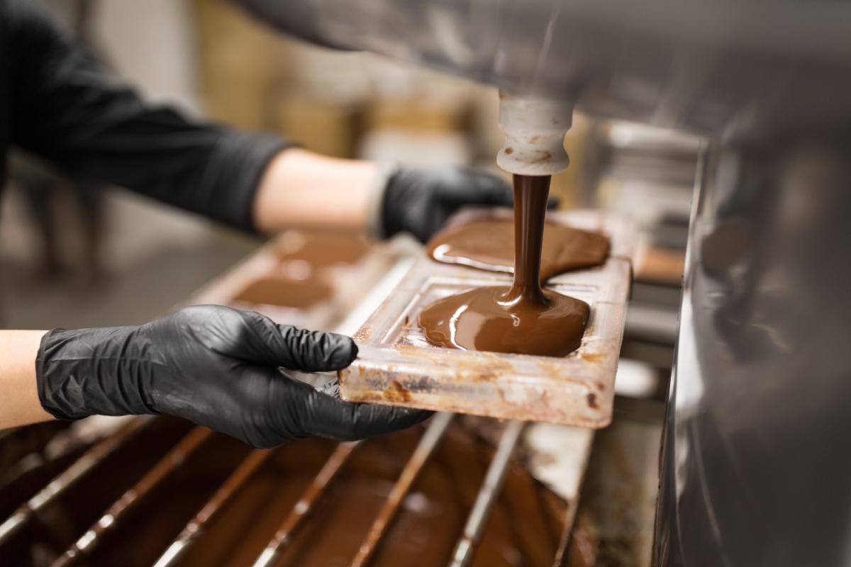 Chocolate pouring into moulds