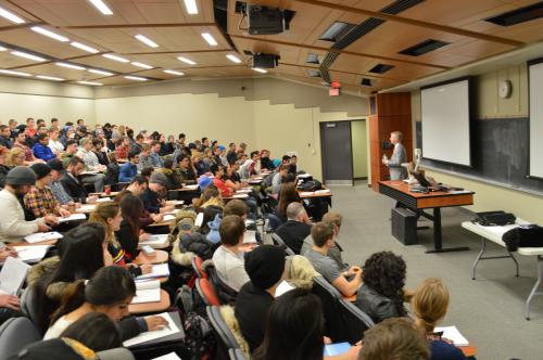 Photo of Ken Miner speaking to third year Economics students at the University of Guelph's business school.