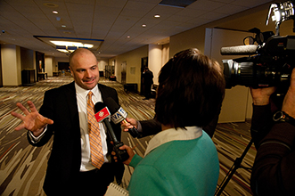 Norm O'Reilly speaking with media