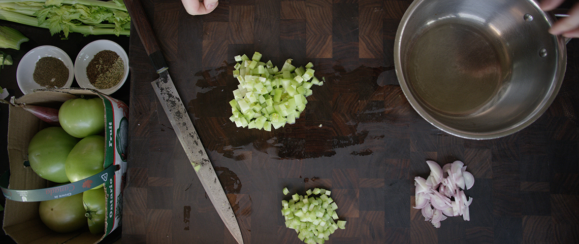 A top-down photo of a counter top with ingredients being prepared. 