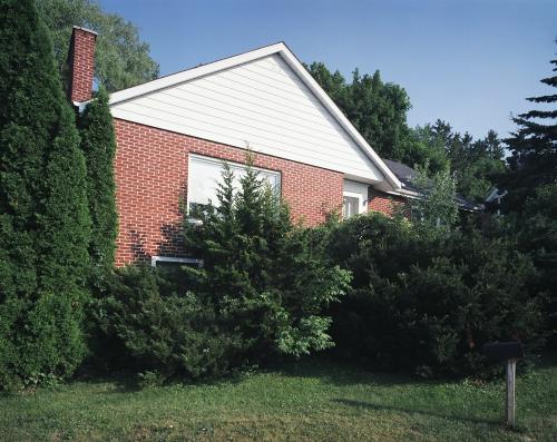 27 University Avenue East is a 1956 red brick bungalow