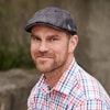 Leith in grey cap and colourful plaid dress shirt
