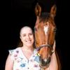 woman posing with a horse