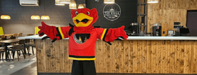gryph standing at the ridge at the ridgetown campus