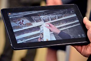 A researcher watches what the participant sees using a tablet that streams real-time footage from the glasses.