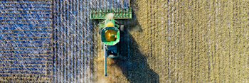 overhead photo of a tractor plowing a field