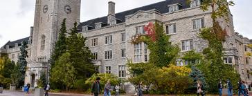 Students walking outside in front of Johnston Hall.