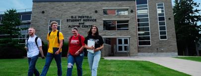 Students walking on campus with Ridgetown Campus Tshirts