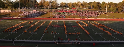 Students on football field spelling "Guelph"