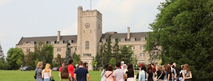 New students and families at a campus tour on Johnston Green
