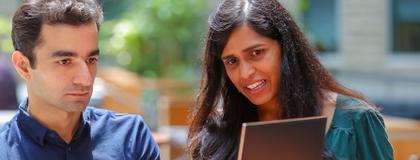 Student and professor with lap top