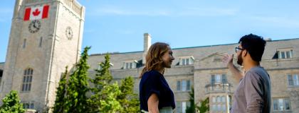 two people talking outside Johnston Hall