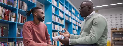 student sitting with his therapist