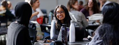 Group of students chatting at the Summerlee Science Complex.
