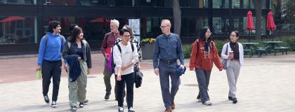 Group of ELP students and instructors walking in Branion Plaza.