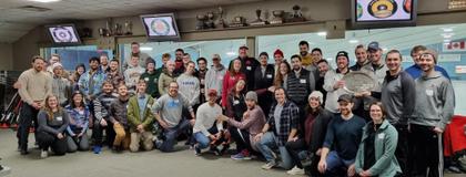 A group photo taken at a curling club