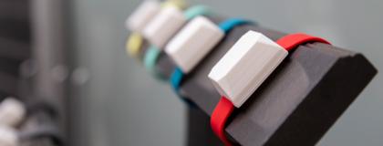 a row of smart watches on a holder