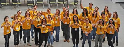 Group of volunteers standing together and smiling.