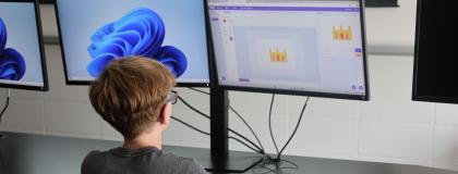 Creative Encounters camper designing a castle on a computer