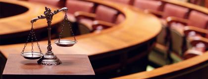 scales of justice in a courtroom