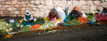 Peruvian women selling produce on the streets of Cusco