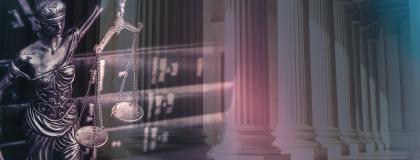 Lady Justice with a stack of law textbooks and building columns