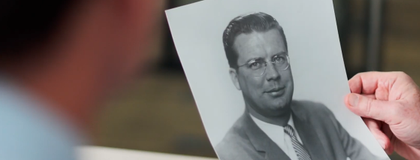 photo of a hand holding a photo of gordon s. lang