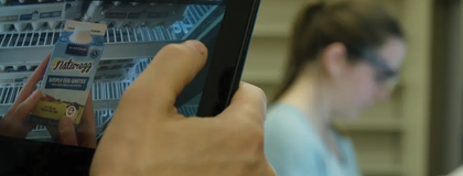 photo of a tablet watching someone pick out a grocery item in the longo's food lab