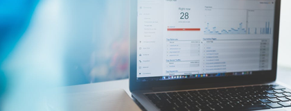 a photo of a laptop with analytics on the screen