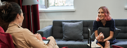 A therapist counsels a client