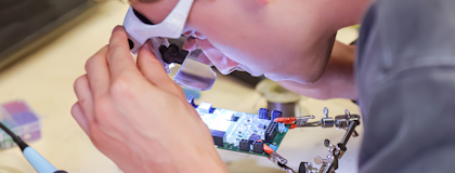 Student working on a computer chip