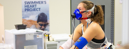 Student cycling in a research lab