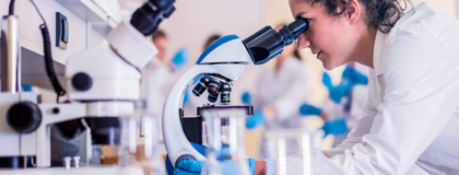 Banner image of researcher in lab