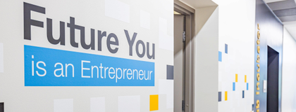 Future You Is an Entrepreneur text on a wall