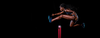 woman jumping hurdles