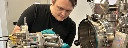 Researcher working on a piece of equipment