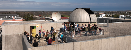 aerial view of the observatory with a group of people outside on the roof