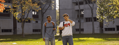 Student walking outside in the fall