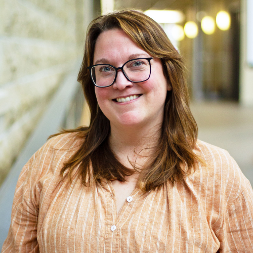 Close-up portrait B.Sc. Program Counsellor Errin- Campbel smiling and wearing glasses, in the Waasamowin Summer Science Complex .